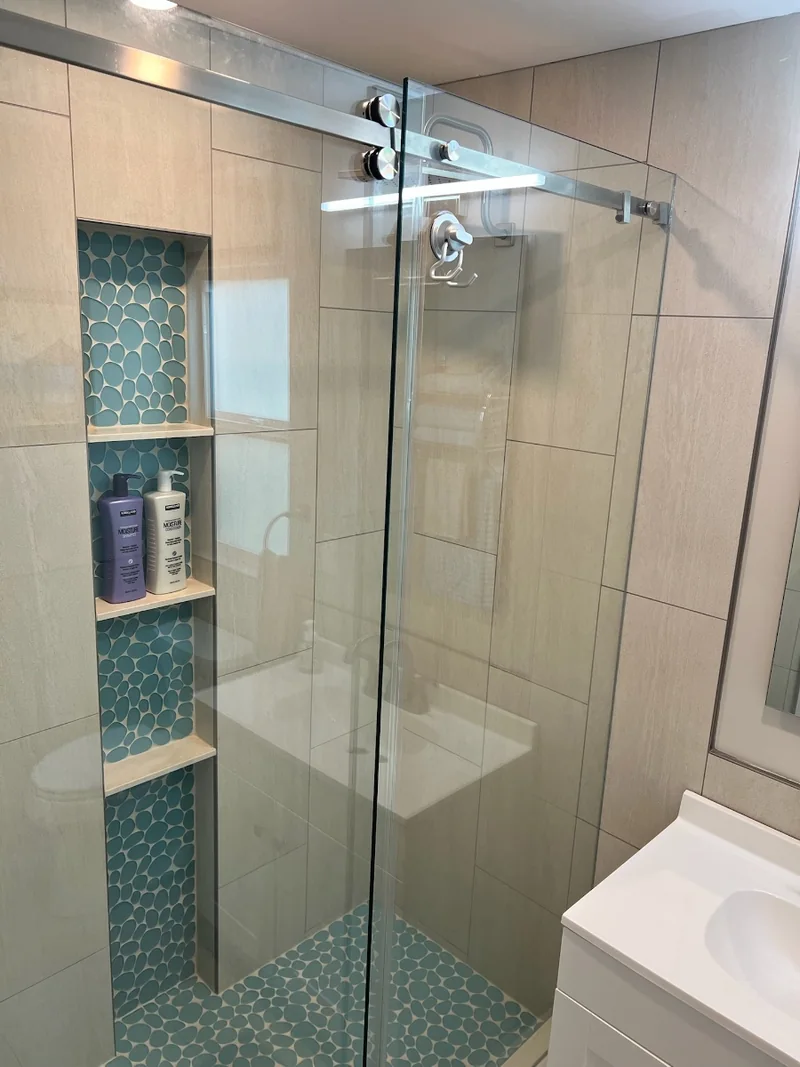 Boundary bathroom with glass shower enclosure