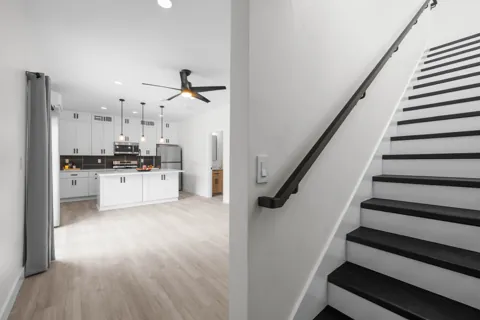 Living space beside an interior stair