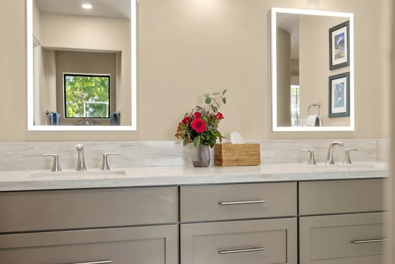 Relocated sinks with stone countertop and vanity storage