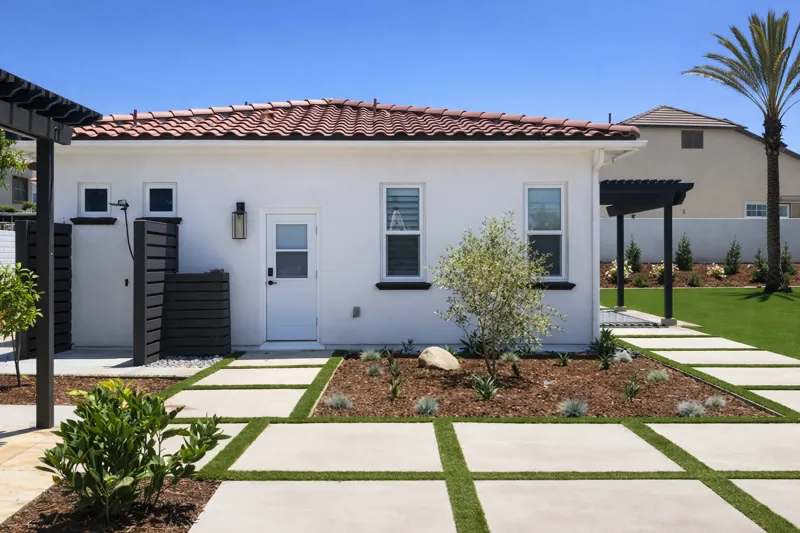 Finished Via Santa exterior with tile roof and landscaped walkway